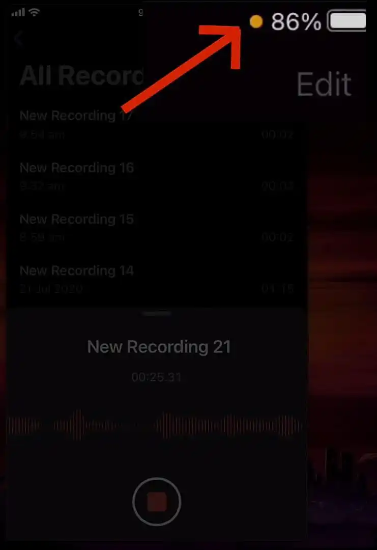 Orange dot indicator on iPhone status bar